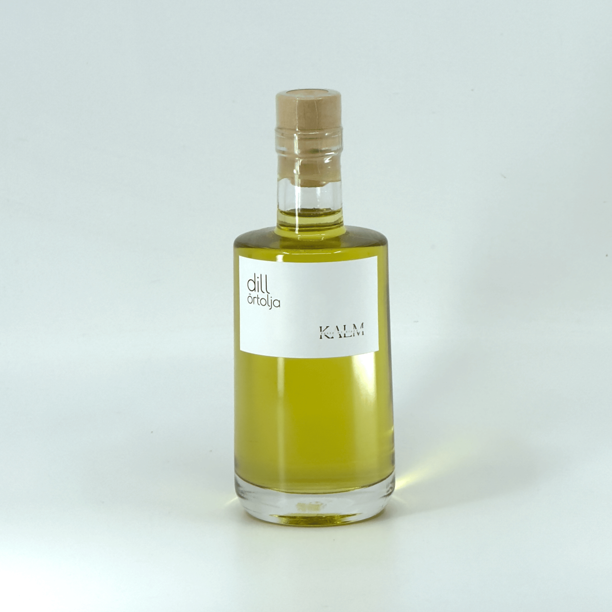 Flaska med Kalm Taste Dillolja – smaksatt rapsolja med färsk dill, producerad utan tillsatser i Kastlösa på Öland. Frisk, nordisk smak.