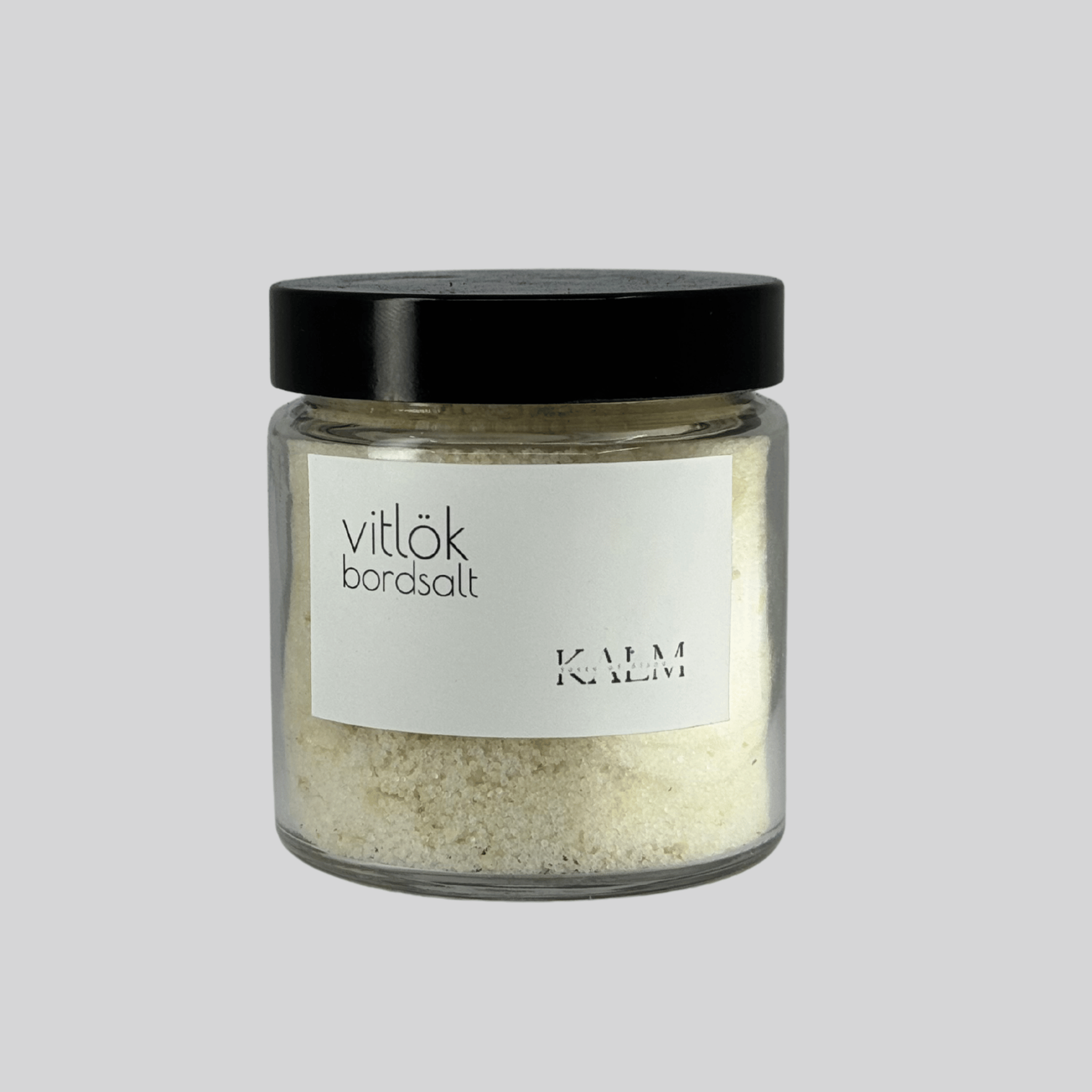 burk med Vitlök bordssalt från Kalm Taste – handgjort örtsalt med Ölandsodlad vitlök och havssalt, perfekt till potatis, kött och grillade rätter.
